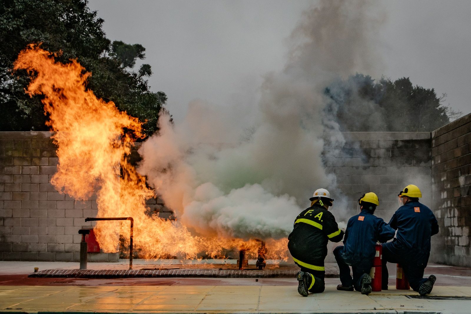 Firefighters working a controlled live-fire training burn