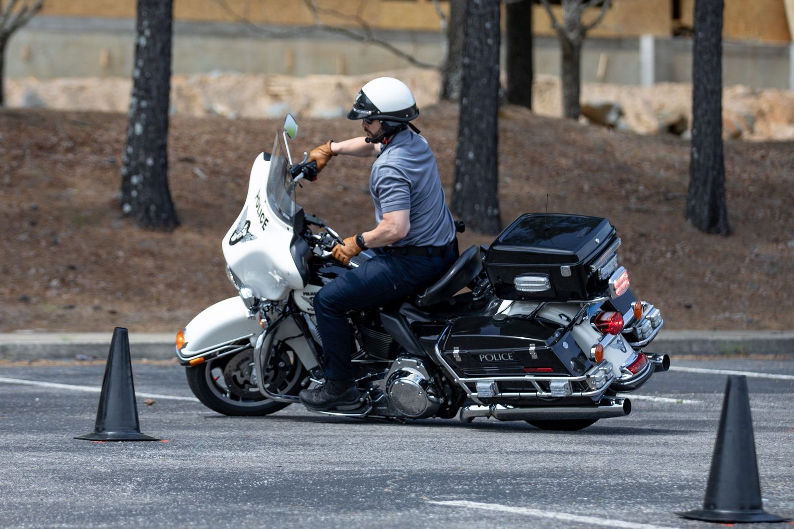 A motor officer riding a cone course during rider training